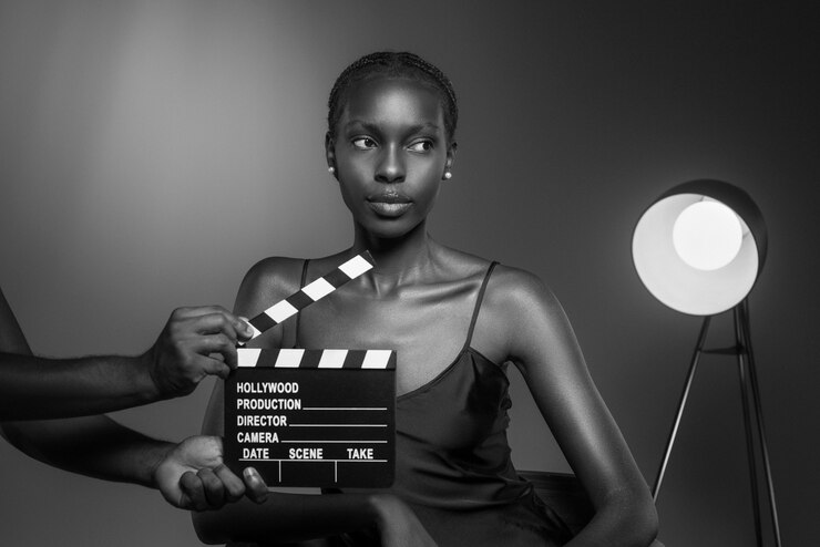 black-white-portrait-woman-with-clapperboard-old-hollywood-glamour-style_23-2150720574